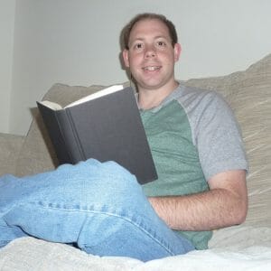 Picture of Joel reading a book.